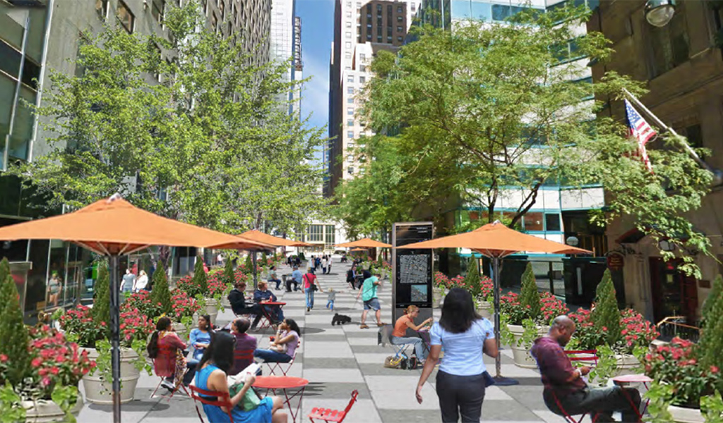  A downtown plaza with outdoor seating and space for pedestrians.